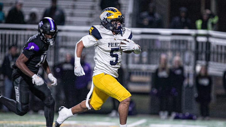 Andrew Beard of Prince Avenue breaks through the middle of Calvary's defense to score a touchdown.