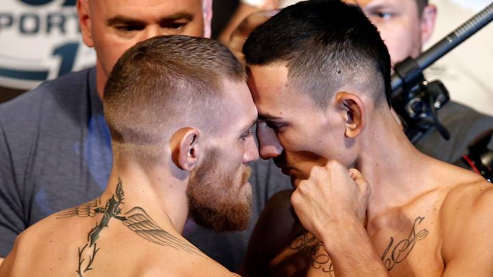 Aug 16, 2013; Boston, MA, USA; Conor McGregor (left) poses with Max Holloway during the weigh-in for their UFC fight at TD Garden tomorrow night. Mandatory Credit: Winslow Townson-USA TODAY Sports Aug 16, 2013; Boston, MA, USA; Conor McGregor (left) poses with Max Holloway during the weigh-in for their UFC fight at TD Garden tomorrow night. Mandatory Credit: Winslow Townson-USA TODAY Sports