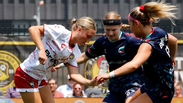 Anna Korney, left, fights for the ball with a few Minnesota Aurora FC defenders Friday at Highmark Stadium in Pittsburgh.  Korney is a 15-year-old student at DuBois High School and plays in the USL W League, which is a pre-professional league.