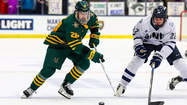 Vermont Freshman Matteo Michels skates past New Hampshire freshman Felix Gagnon Vermont Freshman Matteo Michels skates past New Hampshire freshman Felix Gagnon