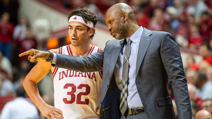 Indiana Director of Player Development Calbert Cheaney talks with Trey Galloway (32) during the Indiana versus Miami (Ohio) men's basketball game at Simon Skjodt Asseembly Hall on Friday, Dec. 6, 2024.