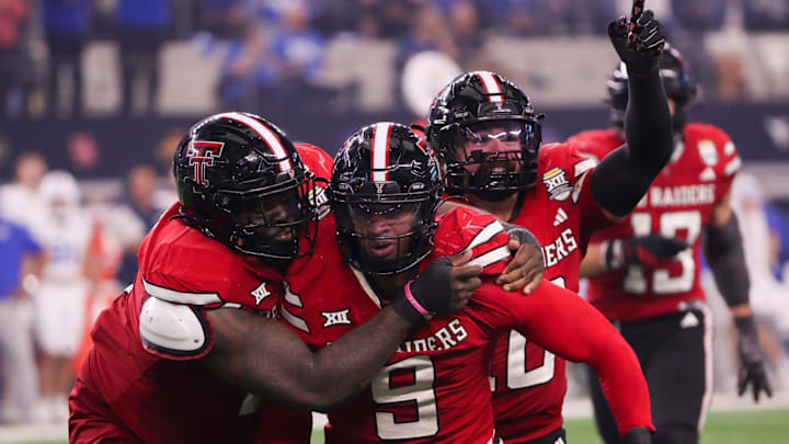 Texas Tech players Lee Hunter (left) and Jacob Rodriguez (back) celebrate Romello Height's fumble recover against BYU during the Big 12 Conference championship football game, Saturday, Nov. 6, 2025, at AT&T Stadium in Arlington. Texas Tech players Lee Hunter (left) and Jacob Rodriguez (back) celebrate Romello Height's fumble recover against BYU during the Big 12 Conference championship football game, Saturday, Nov. 6, 2025, at AT&T Stadium in Arlington.
