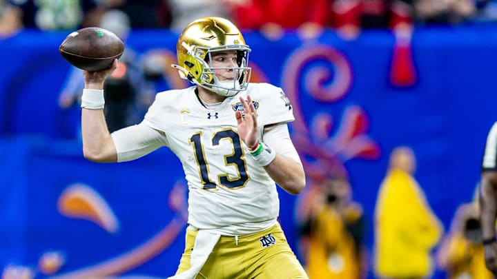 Jan 2, 2025; New Orleans, LA, USA;  Notre Dame Fighting Irish quarterback Riley Leonard (13) passes against the Georgia Bulldogs during the second half at Caesars Superdome.