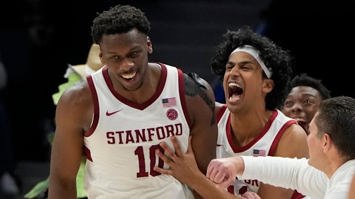 Mar 12, 2025; Charlotte, NC, USA; Stanford Cardinal forward Chisom Okpara (10) reacts with guard Ryan Agarwal (11) after scoring a basket and being fouled late in the second half at Spectrum Center. Mandatory Credit: Bob Donnan-Imagn Images
