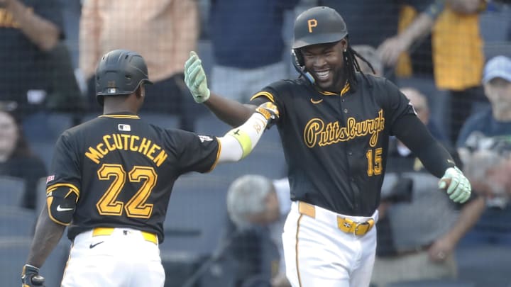 Sep 9, 2024; Pittsburgh, Pennsylvania, USA;  Pittsburgh Pirates center fielder Oneil Cruz (15) celebrates his solo home run with designated hitter Andrew McCutchen (22) against the Miami Marlins during the first inning at PNC Park. Mandatory Credit: Charles LeClaire-Imagn Images