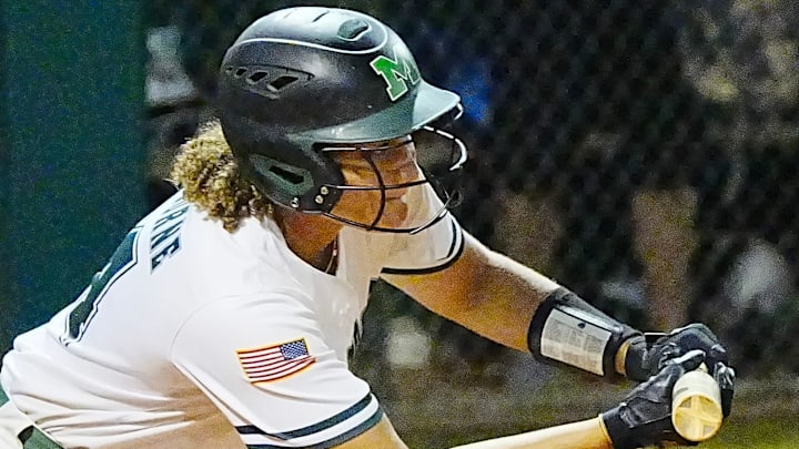 Layla Ayala of Melbourne shows bunt during a game against Palm Beach Gardens in the regional quarterfinals last year. Ayala is batting .625 with six doubles, four triples, five home runs and 30 RBI this year, leading Bulldogs to a 12-0 record and the No. 6 ranking in this week's High School on SI Florida Softball Top 25.