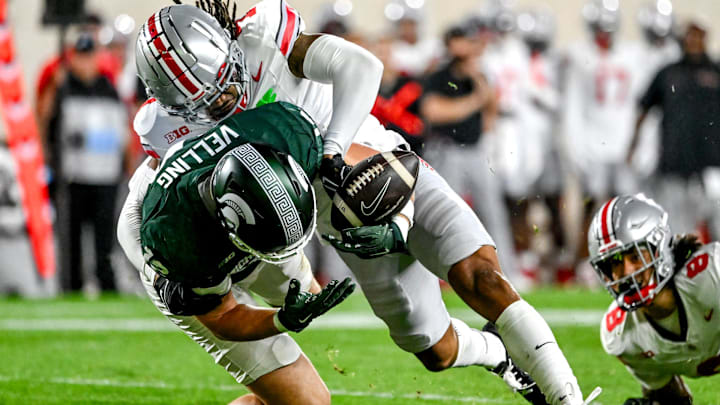 Michigan State's Jack Velling, left, has the ball stripped by Ohio State's Jordan Hancock during the second quarter on Saturday, Sept. 28, 2024, at Spartan Stadium in East Lansing.