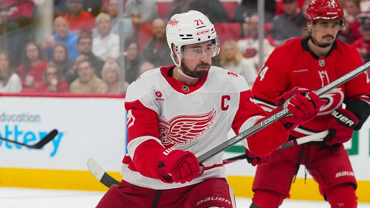 Feb 28, 2026; Raleigh, North Carolina, USA;  Detroit Red Wings center Dylan Larkin (71) takes a shot against the Carolina Hurricanes during the second period at Lenovo Center. Mandatory Credit: James Guillory-Imagn Images