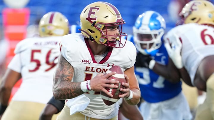 Aug 28, 2025; Durham, North Carolina, USA; Elon Phoenix quarterback Landen Clark (11) rolls out of the pocket against the Duke Blue Devils during the first half at Wallace Wade Stadium. Mandatory Credit: James Guillory-Imagn Images Aug 28, 2025; Durham, North Carolina, USA; Elon Phoenix quarterback Landen Clark (11) rolls out of the pocket against the Duke Blue Devils during the first half at Wallace Wade Stadium. Mandatory Credit: James Guillory-Imagn Images