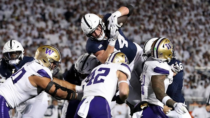 Penn State Nittany Lions tight end Tyler Warren (44) jumps over the Washington Huskies' defense for a touchdown at Beaver Stadium.