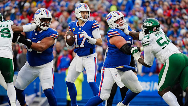 Buffalo Bills quarterback Josh Allen (17) gets pass protection from Buffalo Bills guard O'Cyrus Torrence (64) and Buffalo Bills guard Connor McGovern (66). Buffalo Bills quarterback Josh Allen (17) gets pass protection from Buffalo Bills guard O'Cyrus Torrence (64) and Buffalo Bills guard Connor McGovern (66).