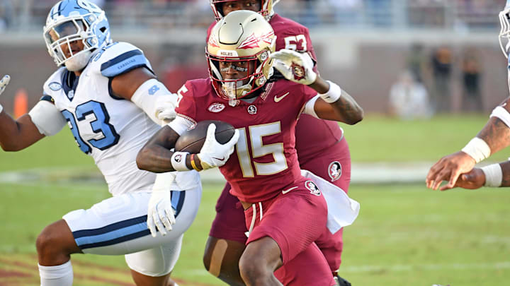 Nov 2, 2024; Tallahassee, Florida, USA;  Florida State Seminoes receiver Lawayne McCoy (15) runs the ball for a two point conversion against the North Carolina Tarheels in the first quarter at Doak S. Campbell Stadium. Mandatory Credit: Robert Myers-Imagn Images