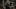 Geralt wielding a sword and axe in a battle deep in a forest. People cower behind a tree in the background. Geralt wielding a sword and axe in a battle deep in a forest. People cower behind a tree in the background.