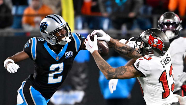 Dec 1, 2024; Charlotte, North Carolina, USA; Tampa Bay Buccaneers wide receiver Mike Evans (13) catches the ball as Carolina Panthers cornerback Michael Jackson (2) defends in overtime at Bank of America Stadium. Mandatory Credit: Bob Donnan-Imagn Images Dec 1, 2024; Charlotte, North Carolina, USA; Tampa Bay Buccaneers wide receiver Mike Evans (13) catches the ball as Carolina Panthers cornerback Michael Jackson (2) defends in overtime at Bank of America Stadium. Mandatory Credit: Bob Donnan-Imagn Images