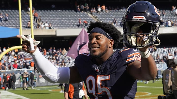 Oct 6, 2024; Chicago, Illinois, USA; Chicago Bears defensive end DeMarcus Walker (95) gestures to the crowd after the game against the Carolina Panthers at Soldier Field. Mandatory Credit: David Banks-Imagn Images