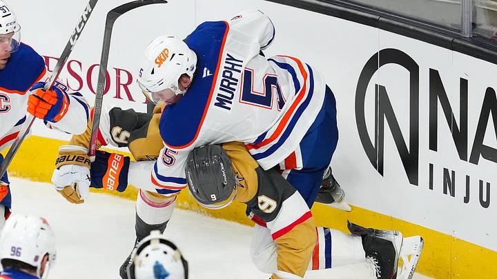 Mar 26, 2026; Las Vegas, Nevada, USA; Edmonton Oilers defenseman Connor Murphy (5) takes down Vegas Golden Knights center Jack Eichel (9) during the third period at T-Mobile Arena. Mandatory Credit: Stephen R. Sylvanie-Imagn Images Mar 26, 2026; Las Vegas, Nevada, USA; Edmonton Oilers defenseman Connor Murphy (5) takes down Vegas Golden Knights center Jack Eichel (9) during the third period at T-Mobile Arena. Mandatory Credit: Stephen R. Sylvanie-Imagn Images