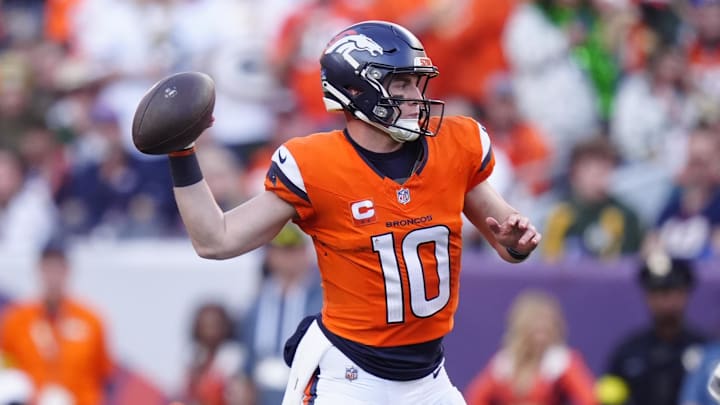 Dec 14, 2025; Denver, Colorado, USA; Denver Broncos quarterback Bo Nix (10) throws downfield during the second quarter against the Green Bay Packers at Empower Field at Mile High. 