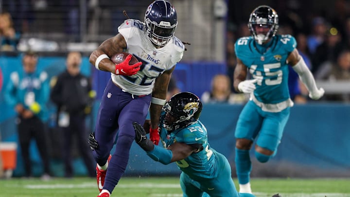 Jan 7, 2023; Jacksonville, Florida, USA;  Tennessee Titans running back Derrick Henry (22) breaks a