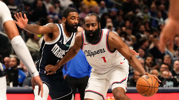 Dec 21, 2024; Dallas, Texas, USA;  LA Clippers guard James Harden (1) drives to the basket ahead of Dallas Mavericks guard Kyrie Irving (11) during the first half at American Airlines Center. Mandatory Credit: Chris Jones-Imagn Images