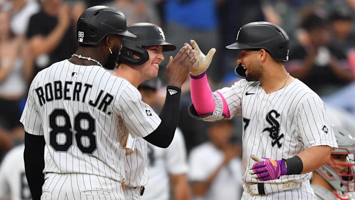 Chicago White Sox catcher Edgar Quero (7) celebrates with designated hitter Kyle Teel (8) and center fielder Luis Robert Jr. (88) after hitting a three-run home run against the Philadelphia Phillies at Rate Field. 