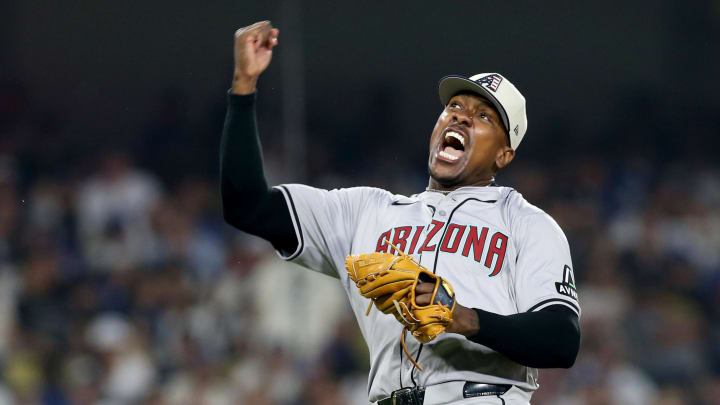Jul 4, 2024; Los Angeles, California, USA; Arizona Diamondbacks pitcher Thyago Vieira (49) reacts after a strikeout to end the game against the Los Angeles Dodgers at Dodger Stadium. Mandatory Credit: Jason Parkhurst-USA TODAY Sports