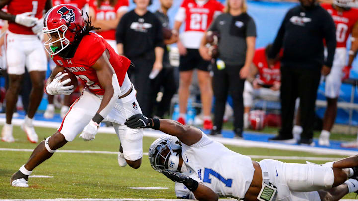 Austin Peay defensive back Javious Bond (2) carries the ball as Middle Tennessee safety Brendon Harris (7) tries to stop him during MTSU's first home football game of the season against Austin Peay, on Saturday, Aug. 30, 2025.