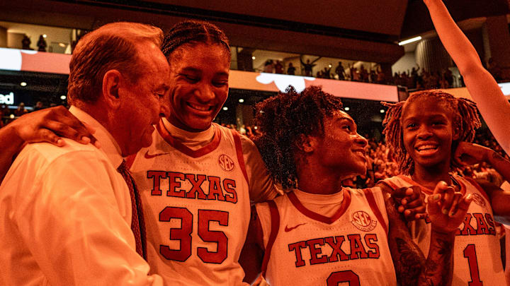 Texas Longhorns head coach Vic Schaefer celebrates with his team after Texas beat the South Carolina Gamecocks 66-62 at home in Austin at the Moody Center, Feb. 9, 2025.