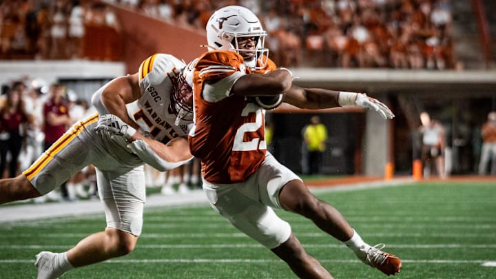 Texas Longhorns wide receiver Ryan Niblett (21) evades a tackle from Louisiana Monroe Warhawks linebacker Brett Drillette (54) to continue to run the ball in the first half of the Texas Longhorns' game against the ULM Warhawks at Darrell K Royal Texas Memorial Stadium in Austin, Sept. 21, 2024. Texas Longhorns wide receiver Ryan Niblett (21) evades a tackle from Louisiana Monroe Warhawks linebacker Brett Drillette (54) to continue to run the ball in the first half of the Texas Longhorns' game against the ULM Warhawks at Darrell K Royal Texas Memorial Stadium in Austin, Sept. 21, 2024.