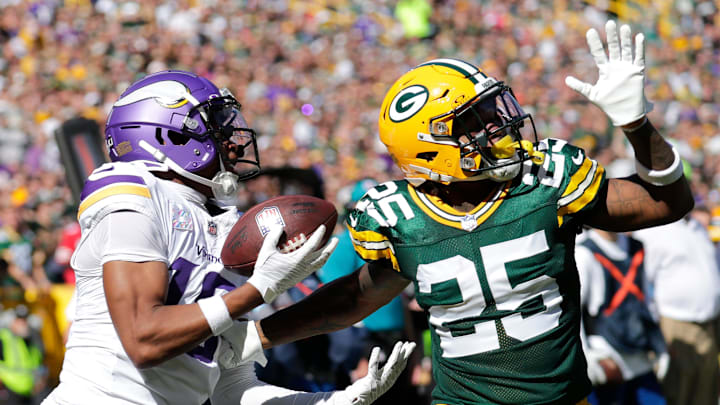 Minnesota Vikings wide receiver Justin Jefferson (18) catches a touchdown pass against Green Bay Packers cornerback Keisean Nixon (25) in the second quarter during their football game Sunday, September 29, 2024, at Lambeau Field in Green Bay, Wisconsin. 
Dan Powers/USA TODAY NETWORK-Wisconsin.
