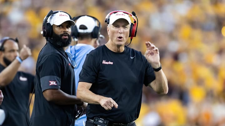 Houston Cougars head coach Willie Fritz (right) and wide receivers coach Derrick Sherman against the Arizona State Sun Devils at Mountain America Stadium. Houston Cougars head coach Willie Fritz (right) and wide receivers coach Derrick Sherman against the Arizona State Sun Devils at Mountain America Stadium.