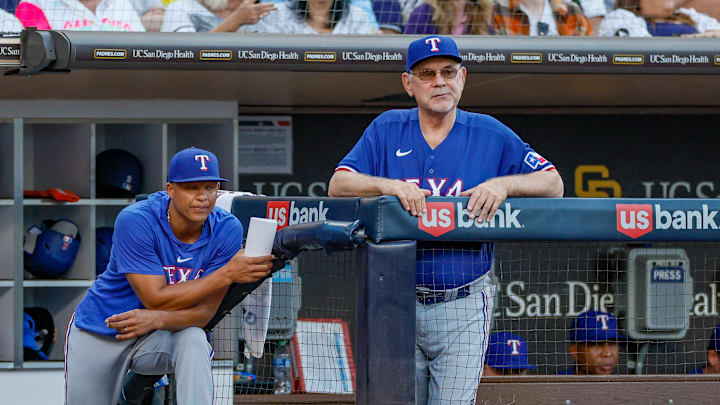 Texas Rangers manager Bruce Bochy (15) and associate manager Will Venable (83) watch on as San Diego Padres starting pitcher Yu Darvish (11) pitches during the fifth inning against the San Diego Padres at Petco Park in 2023.
