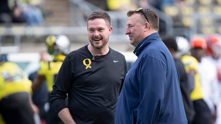 Oregon head coach Dan Lanning, left, and Illinois head coach Bret Bielema talk before the game as the No. 1 Oregon Ducks host the No. 21 Illinois Fighting Illini Saturday, Oct. 26, 2024 at Autzen Stadium in Eugene, Ore. Oregon head coach Dan Lanning, left, and Illinois head coach Bret Bielema talk before the game as the No. 1 Oregon Ducks host the No. 21 Illinois Fighting Illini Saturday, Oct. 26, 2024 at Autzen Stadium in Eugene, Ore.