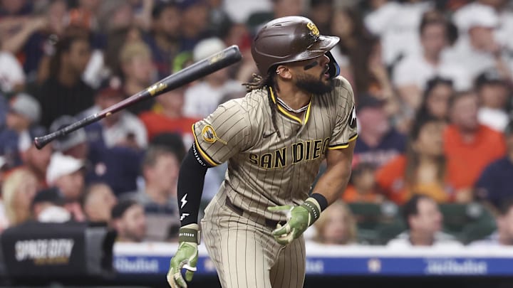 Apr 18, 2025; Houston, Texas, USA; San Diego Padres right fielder Fernando Tatis Jr. (23) hits a single during the fifth inning against the Houston Astros at Daikin Park. Mandatory Credit: Troy Taormina-Imagn Images