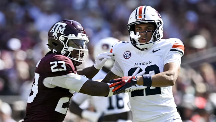 Sep 27, 2025; College Station, Texas, USA; Texas A&M Aggies running back Jamarion Morrow (23) runs a route as Auburn Tigers cornerback Donovan Starr (22) defends in coverage during the first half at Kyle Field. Mandatory Credit: Maria Lysaker-Imagn Images Sep 27, 2025; College Station, Texas, USA; Texas A&M Aggies running back Jamarion Morrow (23) runs a route as Auburn Tigers cornerback Donovan Starr (22) defends in coverage during the first half at Kyle Field. Mandatory Credit: Maria Lysaker-Imagn Images