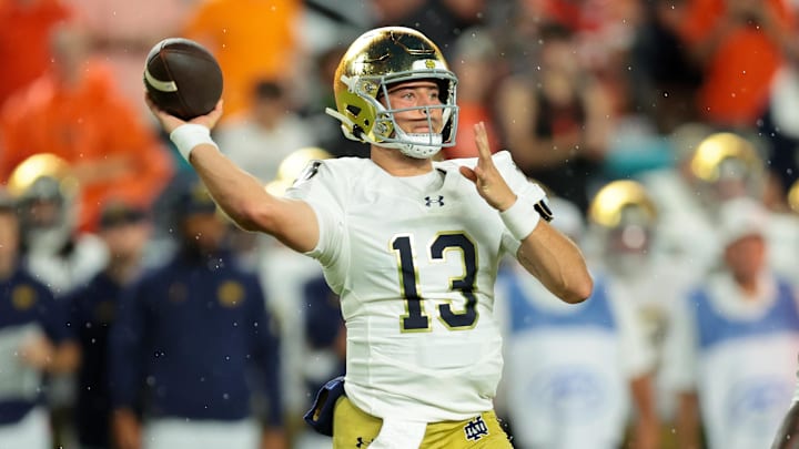 Aug 31, 2025; Miami Gardens, Florida, USA; Notre Dame Fighting Irish quarterback CJ Carr (13) drops back to pass against the Miami Hurricanes during the first quarter at Hard Rock Stadium. Mandatory Credit: Sam Navarro-Imagn Images