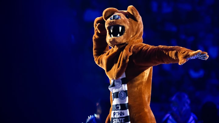 The Penn State Nittany Lion mascot cheers before a Big Ten wrestling match vs. the Ohio State Buckeyes. 