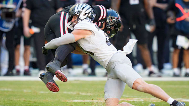 Oregon defensive back Dillon Thieneman, right, brings down Texas Tech quarterback Behren Morton Oregon defensive back Dillon Thieneman, right, brings down Texas Tech quarterback Behren Morton
