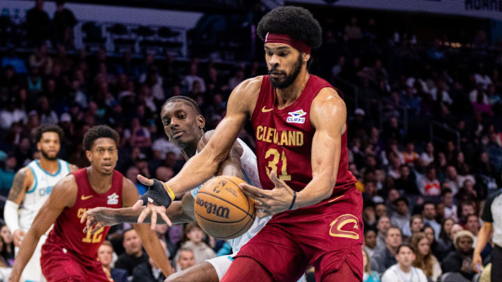 Mar 7, 2025; Charlotte, North Carolina, USA; Cleveland Cavaliers center Jarrett Allen (31) cuts off a pass to Charlotte Hornets forward Moussa Diabate (14) during the first quarter at Spectrum Center. Mandatory Credit: Scott Kinser-Imagn Images