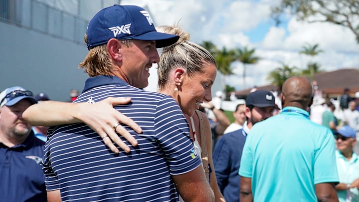 Jake Knapp is congratulated by his girlfriend Makena White after shooting a course record 59 in the first round of the Cognizant Classic in the Palm Beaches at PGA National Resort & Spa on Thursday, February 27, 2025, in Palm Beach Gardens, FL.