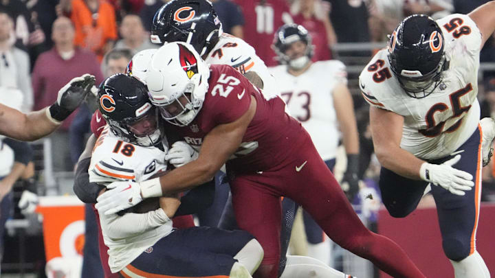 Caleb Williams is smashed to the ground by Zaven Collins in the Cardinals' 29-9 victory Sunday over the Bears.