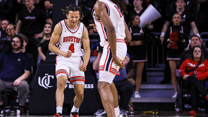 Jan 3, 2026; Cincinnati, Ohio, USA; Houston Cougars guard Kingston Flemings (4) reacts after a play in the second half against the Cincinnati Bearcats at Fifth Third Arena. 