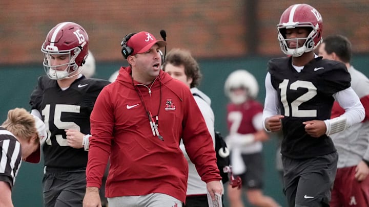Mar 5, 2025; Tuscaloosa, AL, USA; Quarterbacks coach Nick Seridan walks between quarterbacks Ty Simpson (15) and Keelon Russell (12)during Spring Practice for the Crimson Tide.