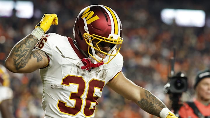 Nov 30, 2025; Landover, Maryland, USA; Washington Commanders running back Chris Rodriguez Jr. (36) celebrates after scoring a touchdown against the Denver Broncos in the second quarter at Northwest Stadium.