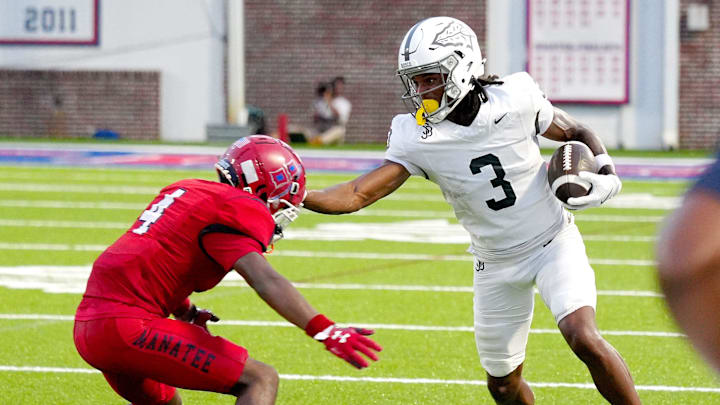 Bosco's wide receiver Daniel Odom (#3) is forced out of bounds by Manatee's defensive back Zyaire Green (#10). The Manatee Hurricanes hosted St. John Bosco (California) with a 31-0 lead over Manatee at halftime. After a long lightning delay the rest of the game was canceled at Joe Kinnan Field at Hawkins Stadium on Friday August 22, 2025, in Bradenton, Florida.
