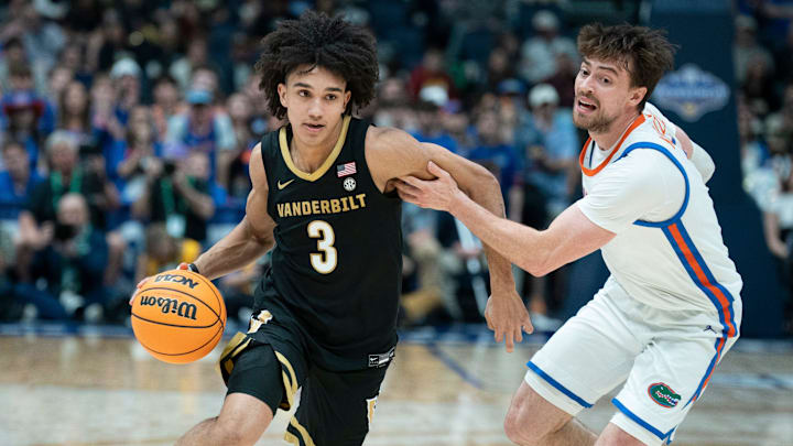 Vanderbilt guard Tyler Tanner (3) drives against Florida guard Urban Klavzar (7)