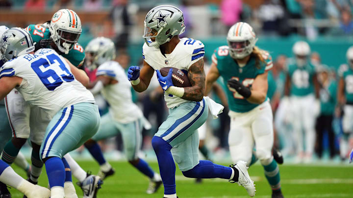 Dec 24, 2023; Miami Gardens, Florida, USA; Dallas Cowboys running back Tony Pollard (20) rushes with
