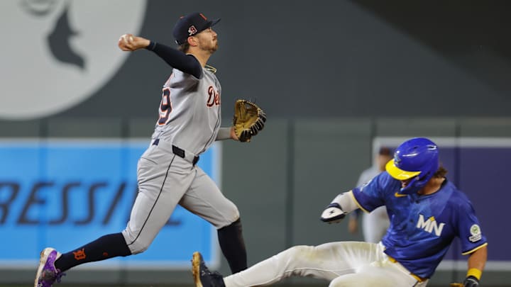 Aug 15, 2025; Minneapolis, Minnesota, USA; Detroit Tigers right fielder Zach McKinstry (39) forces out Minnesota Twins second baseman Luke Keaschall (15) and turns a double play on a ball hit by right fielder Matt Wallner (not pictured) in the sixth inning at Target Field. Mandatory Credit: Bruce Kluckhohn-Imagn Images