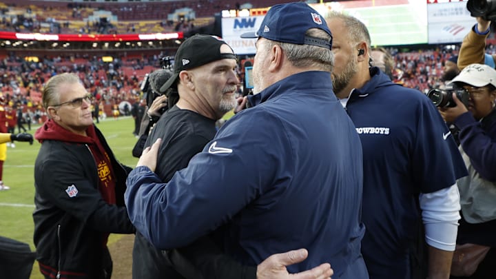 Washington Commanders head coach Dan Quinn hugs Dallas Cowboys head coach Mike McCarthy after their game at Northwest Stadium. 