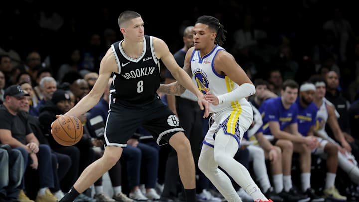 Dec 29, 2025; Brooklyn, New York, USA; Brooklyn Nets guard Egor Demin (8) controls the ball against Golden State Warriors guard Will Richard (3) during the second quarter at Barclays Center. Mandatory Credit: Brad Penner-Imagn Images
