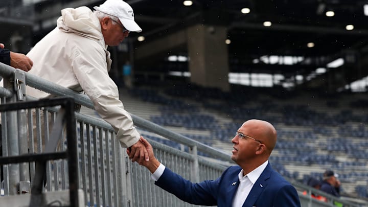 Penn State Nittany Lions head coach James Franklin shakes hands with a fan prior to the game against the FIU Panthers at Beaver Stadium. Penn State Nittany Lions head coach James Franklin shakes hands with a fan prior to the game against the FIU Panthers at Beaver Stadium.